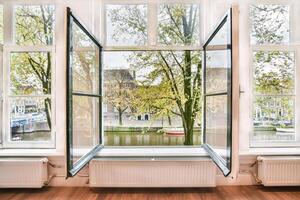 An open window with a view of a river photo