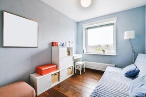 A small room with a bed, desk and window photo