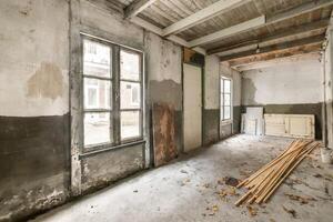 An empty room with wood and a window photo