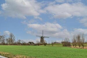 A field with a windmill photo