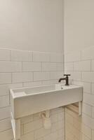 A bathroom with a sink and a toilet in it photo