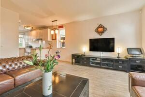 A living room with leather furniture and a flat screen tv photo