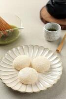 White Mochi Coated with Dried Coconut Flakes photo