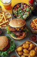 A vibrant yellow background featuring fast food items like burgers, nuggets, and fries photo