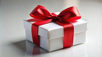 red ribbon, wide, angle, rectangle, White gift box with a red ribbon bow tie on top photographed from a closeup wide horizontal angle It is a large minimalist rectangle shaped box photo