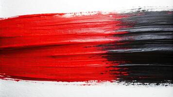 Abstract painting with bold brush strokes in red and black on white background photo