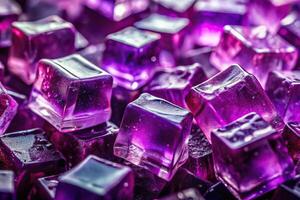 Abstract background made from purple blackcurrant jello chunks with candy sweets, backlit clear ice or jelly cubes, and depth of field photo