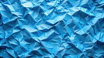 Abstract blue scrunched paper background with triangles photo