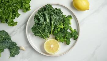 Vegetable kale, broccoli and lemon simple real food homemade copy space background photo