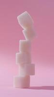 A stack of crystal sugar cube balancing standing concept solid background photo