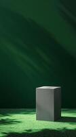 Slightly dark green wall with shadow and gray blocks stage podium story background photo