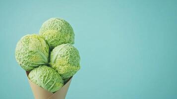 Green cabbage vegetable on brown paper grocery cone bag eco friendly package photo