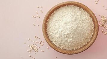 Quinoa flour on brown wooden bowl and some Quinoa seeds for baking, gluten free copy space photo