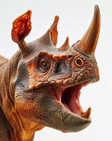 A close up of a toy rhino with its mouth open photo