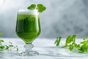 A glass of green liquid photo