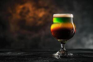 A glass of beer with a colorful liquid photo