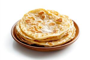 A bowl of flatbreads on a white background photo