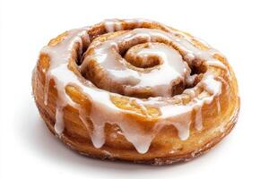 A cinnamon roll with icing on top photo