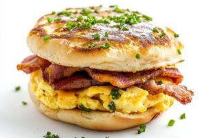 A breakfast sandwich with bacon and eggs photo