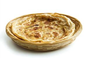 A small flatbread in a basket on a white background photo