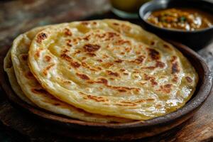 Indian flatbreads on a wooden plate photo
