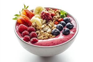 A bowl of fruit smoothie with berries, bananas and granola photo