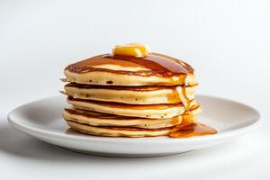 A stack of pancakes on a plate photo