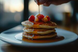 A stack of pancakes on a plate photo