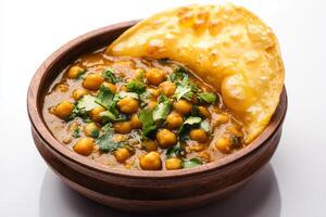Chickpea curry in a bowl with a tortilla photo