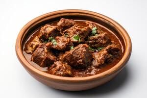 Indian beef curry in a brown bowl photo