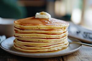 A stack of pancakes on a plate photo