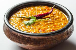 Indian lentil curry with cilantro and chili photo