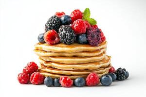 Stack of pancakes with berries and mint photo
