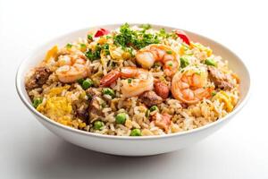 A bowl of fried rice with shrimp and vegetables photo