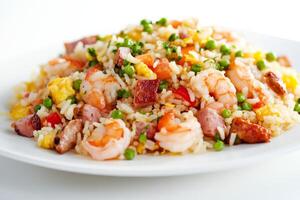 A plate of fried rice with shrimp and vegetables photo
