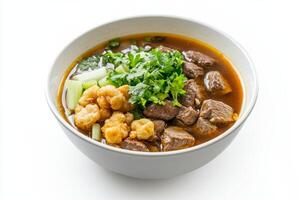 A bowl of beef and vegetables with a spoon photo
