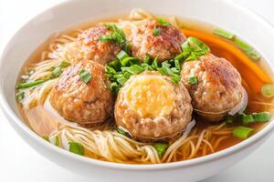 Chinese meatball soup with noodles and meatballs photo