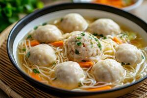 Chinese dumplings in soup photo