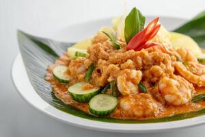 A plate of food with shrimp and vegetables photo