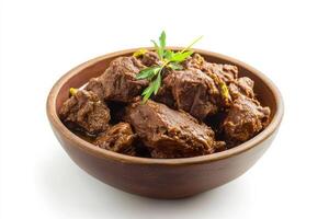 A bowl of beef with a sprig of rosemary photo