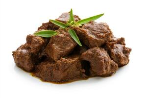 A pile of beef with a green leaf on top photo