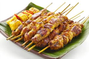 A plate of skewers with meat and vegetables photo