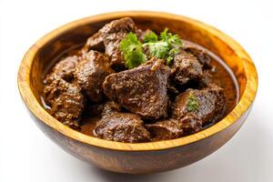A bowl of beef stew with a spoon photo