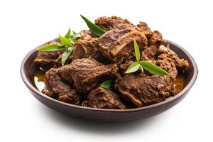 A bowl of meat with leaves on top photo