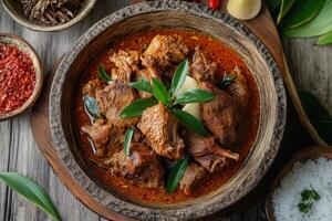 Chicken curry in a bowl with rice and spices photo