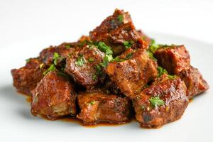 A plate of meat with parsley on top photo