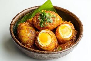 A bowl of food with two eggs in it photo