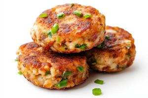 Three meat patties with green onions on top photo