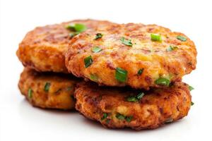 Three cheese patties with green onions on top photo