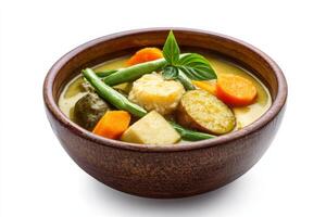 A bowl of soup with vegetables and green beans photo